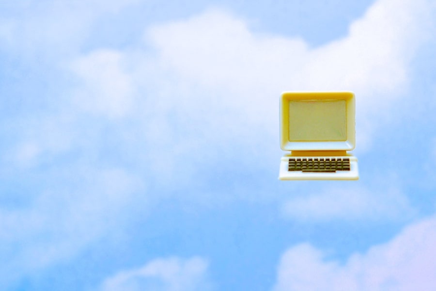 An old computer floating in the clouds.