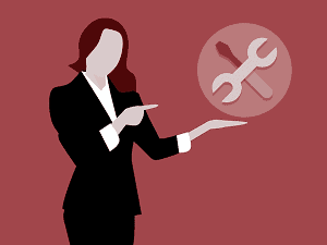 Illustration of business woman pointing to repair tools