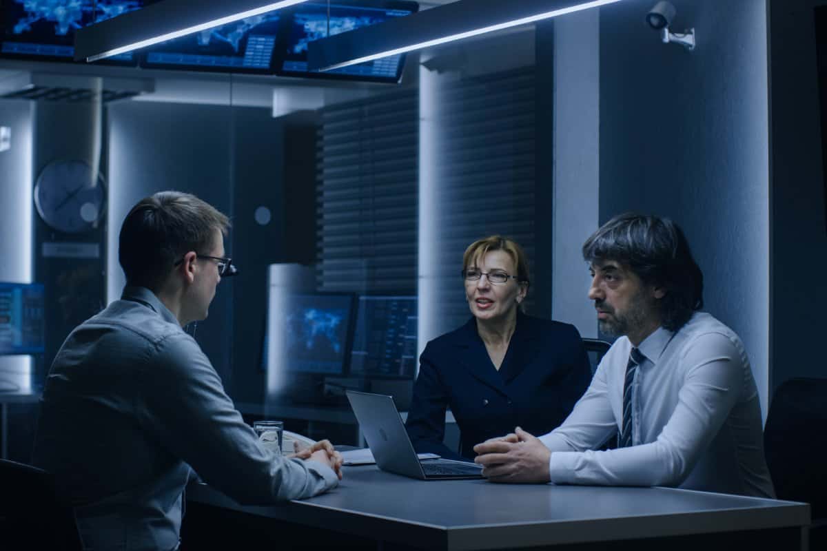 Two IT Specialists walking in a server room