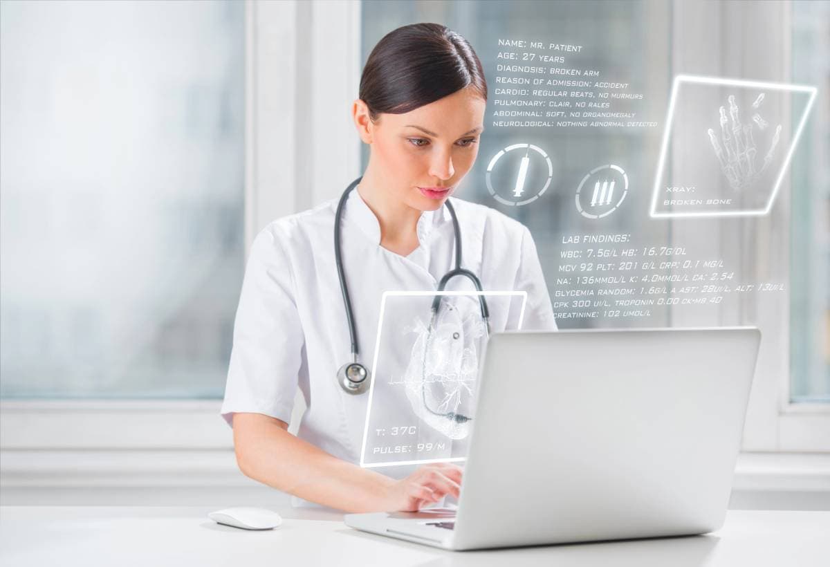 A doctor using advanced Portland healthcare IT systems to review patient data.