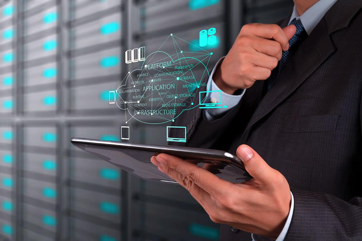 A professional using a tablet for San Jose IT support in a server room.