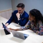 businessman businesswoman black african american diversity person work job career occupation laptop tablet notebook computer teamwork colleague partner together friendship business meeting conference